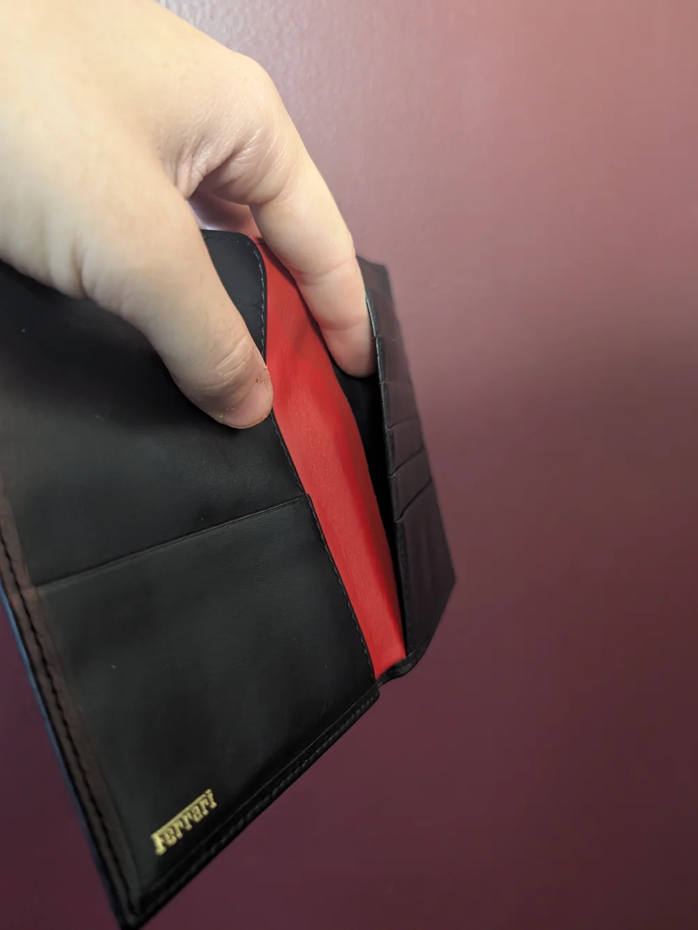 FERRARI Black Leather Passport Wallet with Embossed Shield Logo Red Inside